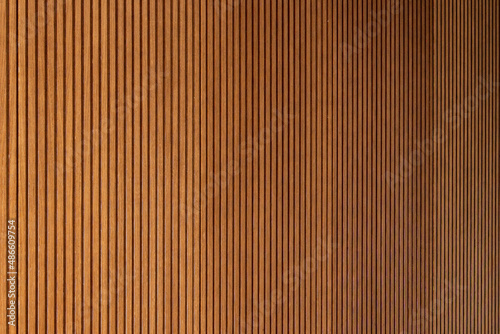 Detail of a wooden wall with a linear relief and texture photo