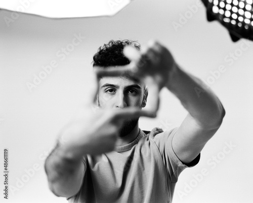 Young man posing in a studio 
 photo