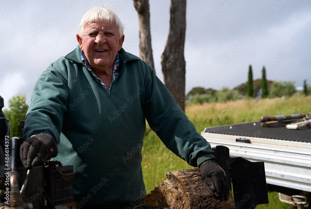 Portrait of senior man working outdoors