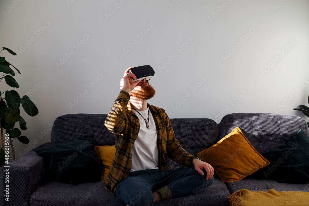 © Danil Nevsky/Stocksy - Man enjoying virtual reality in headset © Danil Nevsky/Stocksy - Man enjoying virtual reality in headset