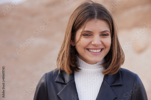 cute young woman at desert smilling, sweet smile photo