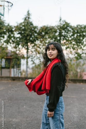 Young southasian woman in red scarf photo