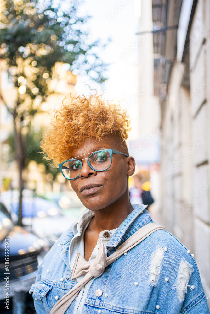 © Luis Velasco/Stocksy - Portrait Of An Urban Black Woman Looking At Camera. © Luis Velasco/Stocksy - Portrait Of An Urban Black Woman Looking At Camera.