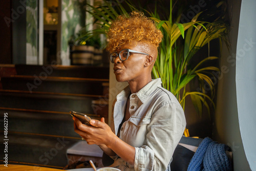 Black Woman Waiting In A Cafe.