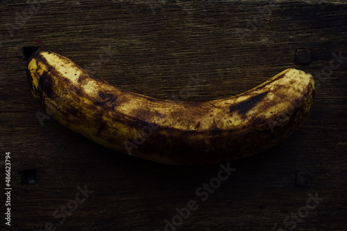Well ripe banana on a wooden vintage table