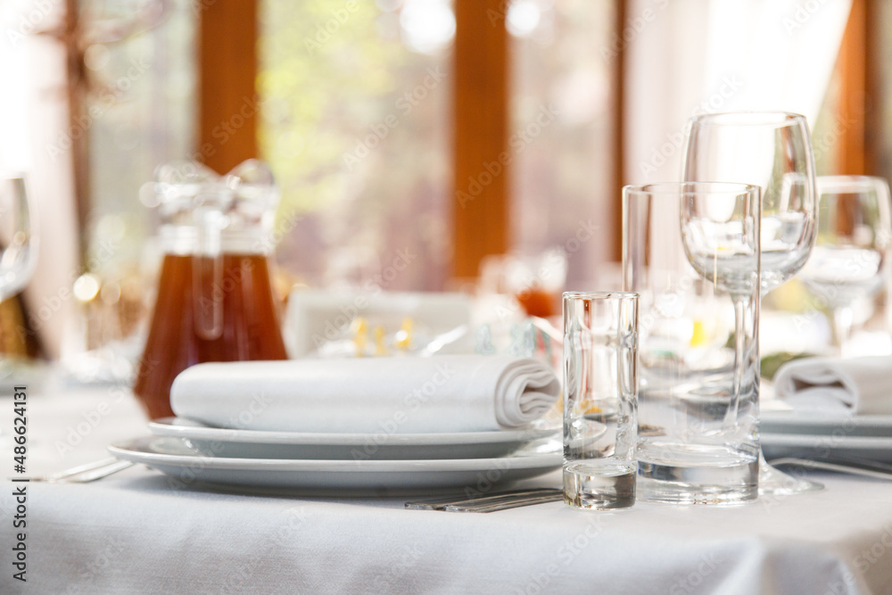 Fototapeta premium Table setting. Restaurant Served table for party in light neutral colors