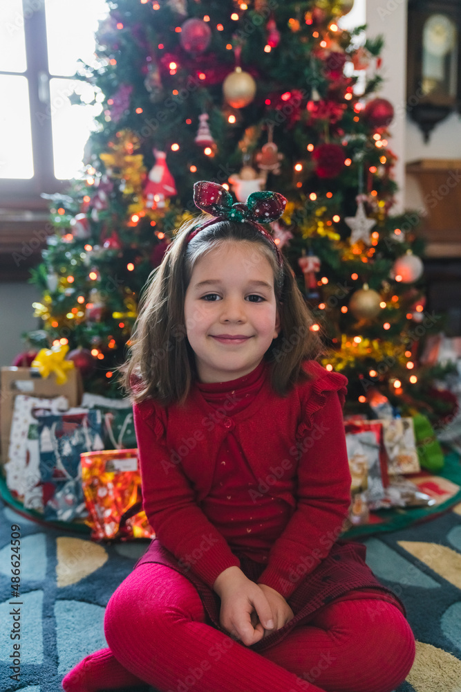 Little Girl Portrait in front of the Christmas Tree Little Girl Portrait in front of the Christmas Tree