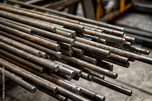 A bundle of round metal bars, steel mill products