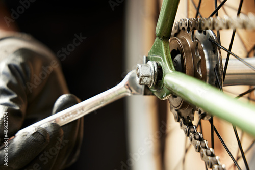 Bike mechanic repairs bicycle