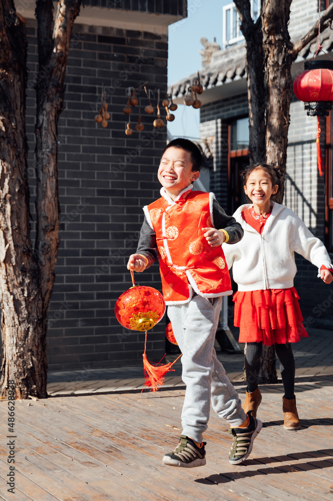Happy kids playing in the yard Stock Photo | Adobe Stock