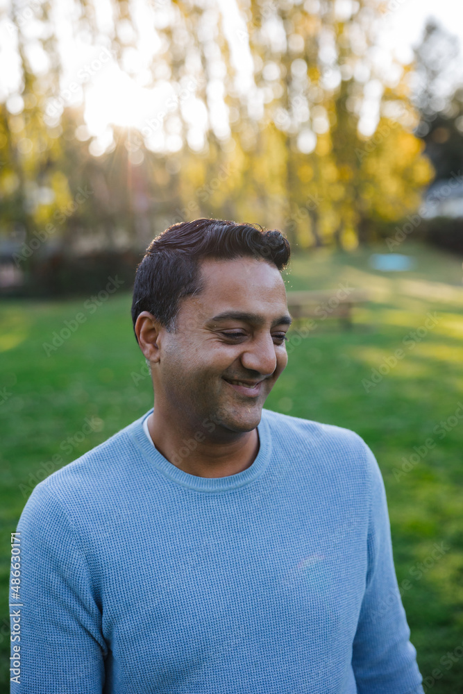Smiling man in sweater outside Smiling man in sweater outside