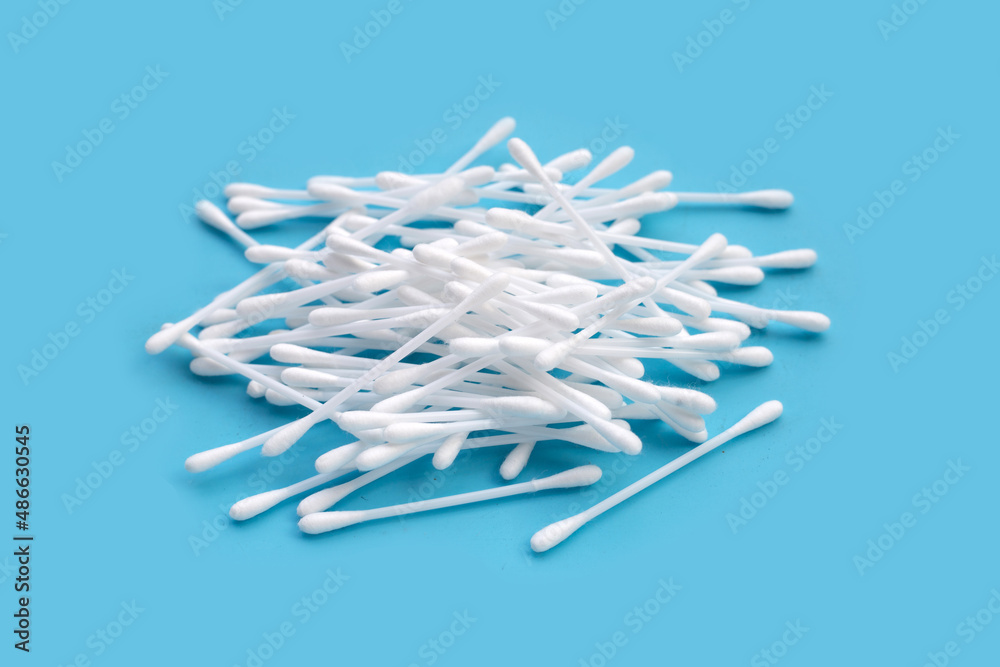 Cotton buds on blue background. Cotton buds on blue background.