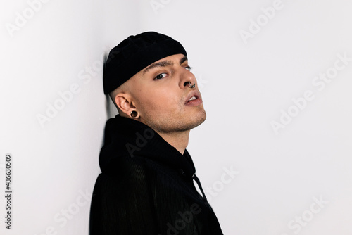 Stylish alternative young man in black jacket