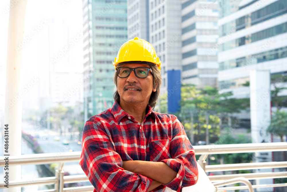 Architect at work in a construction site Engineers man construction safety work concept and construction city .Engineer Concept Architect at work in a construction site Engineers man construction safety work concept and construction city .Engineer Concept