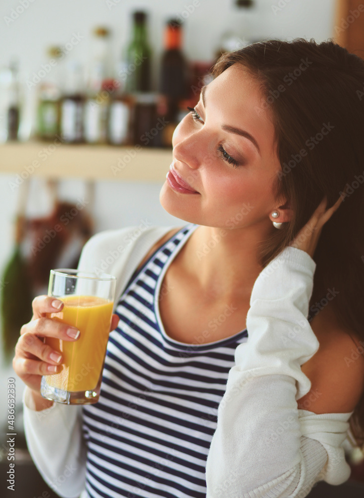 Portrait of a pretty woman holding glass with tasty juice Portrait of a pretty woman holding glass with tasty juice