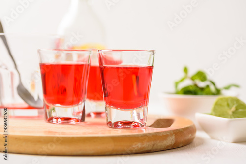 Red tequila with lime and mint on white background, Tropical spring and summer vacation concept