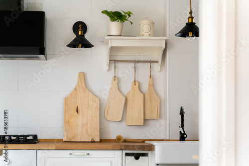 Handmade wooden cutting boards in kitchen photo