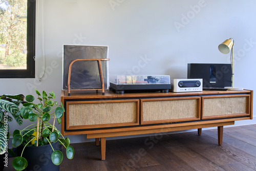 Vintage radiogram with Record deck and record collection photo