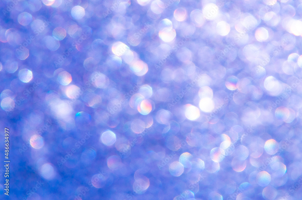 Fototapeta premium bright glitter background: bokeh effect from many colored lights on frozen glass, toning