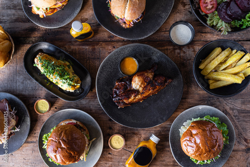 Table full of plates with food photo