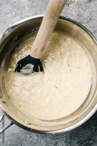 Making creamy Au Gratin sauce