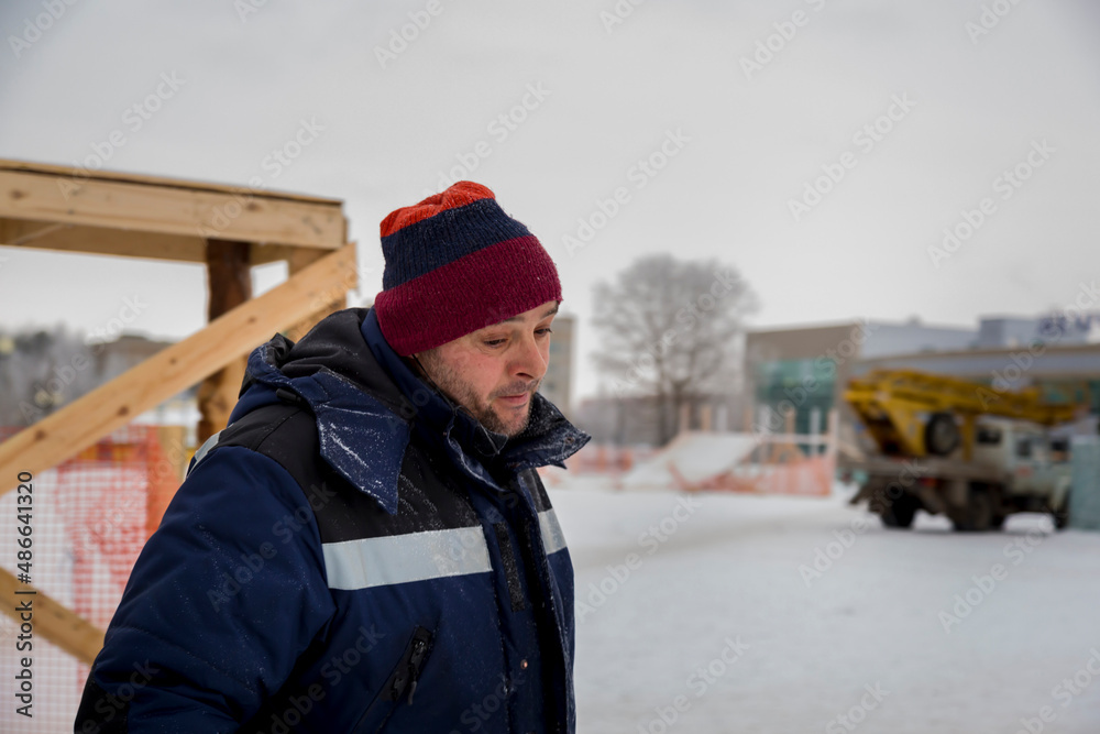 Close-up portrait of a worker at a construction site