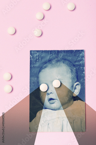 Old photo of baby with pills photo