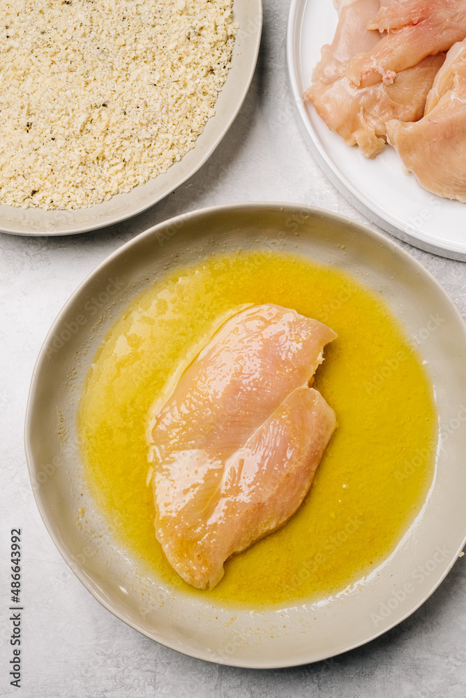 Preparing breaded chicken breasts Preparing breaded chicken breasts