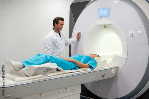 Doctor doing MRI procedure in clinic photo