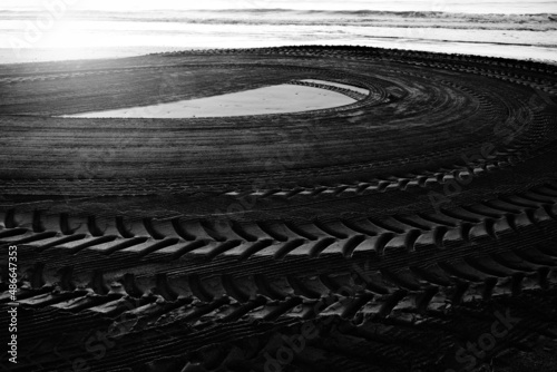 Tractor tracks in the sand.
