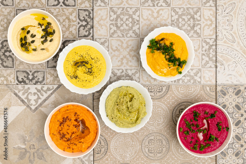 Healthy food : colorful hummus bowls photo
