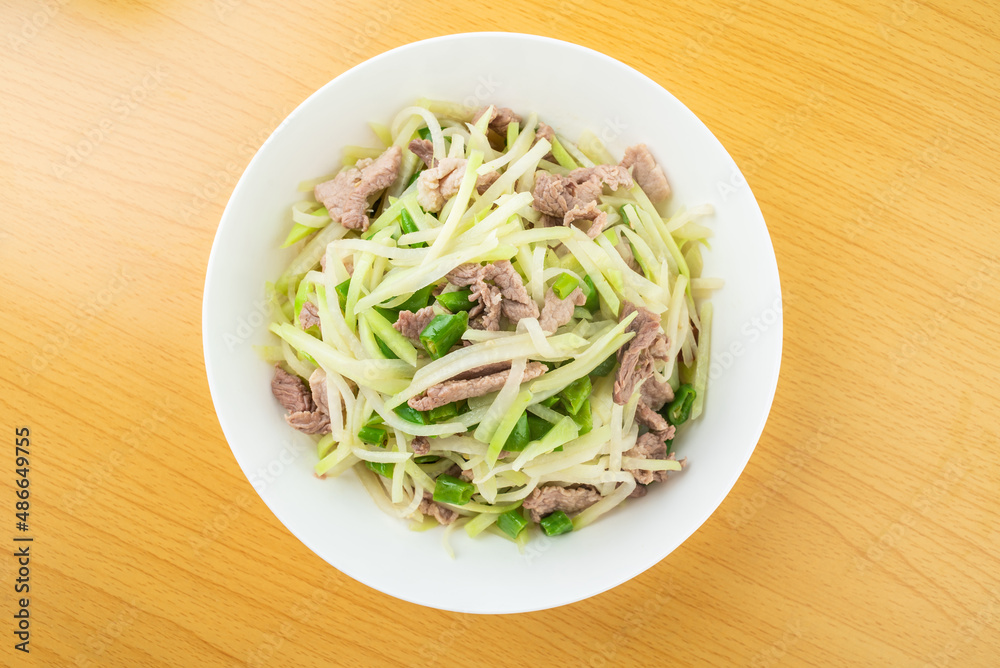 A plate of fried pork with kohlrabi A plate of fried pork with kohlrabi