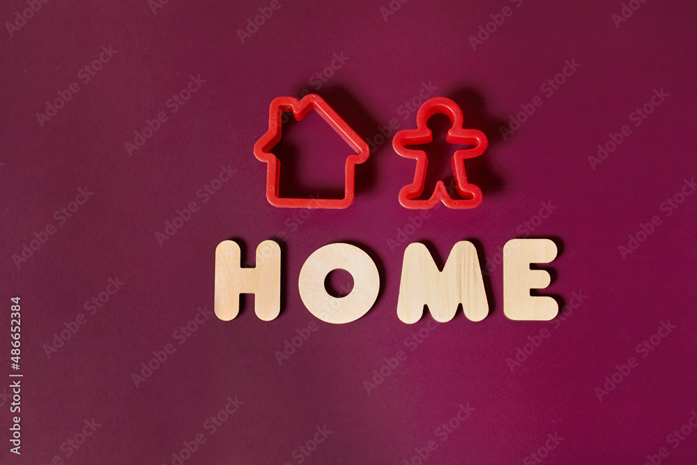 Two baking pans in the shape of a house and a person and the inscription Home Two baking pans in the shape of a house and a person and the inscription Home