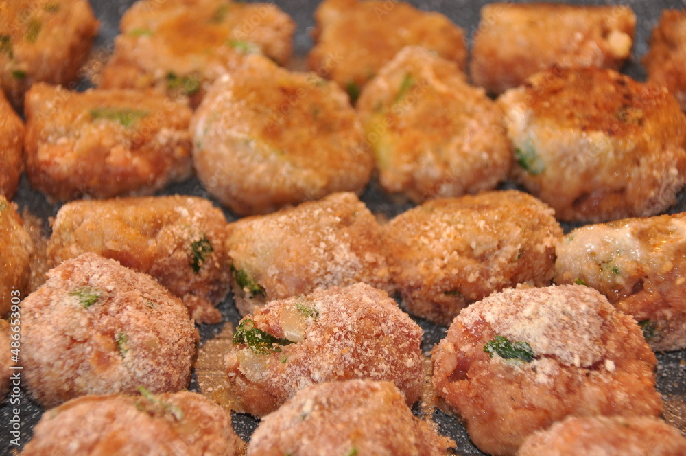 Meatballs with parsley and in breadcrumbs and tomato sauce with spices. Delicious meat dinner dish for potatoes and salads.