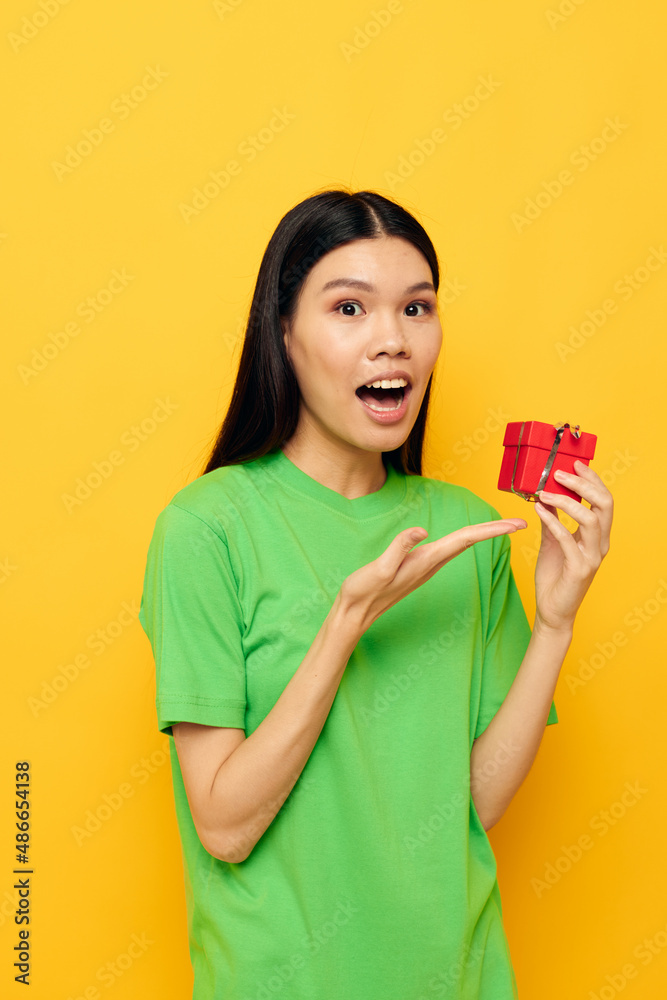 pretty brunette Red gift box happy Birthday yellow background unaltered pretty brunette Red gift box happy Birthday yellow background unaltered