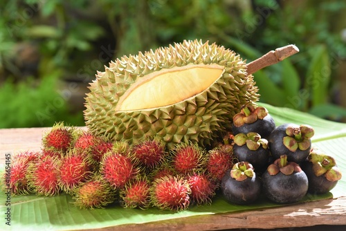 durian with rambutan and mangosteen on banana leaf in garden