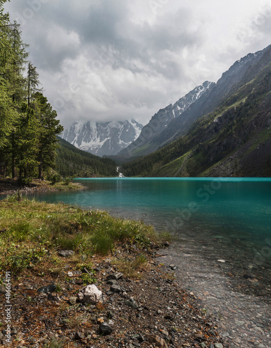 Lake shore on a rainy day in the Altai mountains