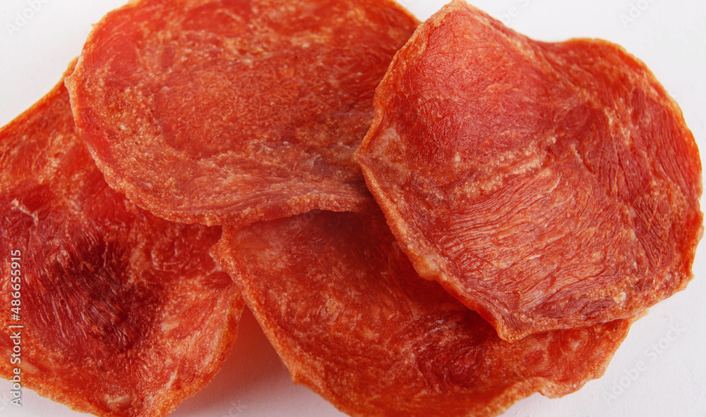 Obraz premium A few pieces of meat chips on a white background. Meat chips.