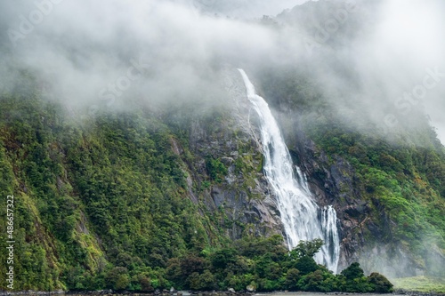 Mystical beautiful waterfall in Milford Sound  New Zealand