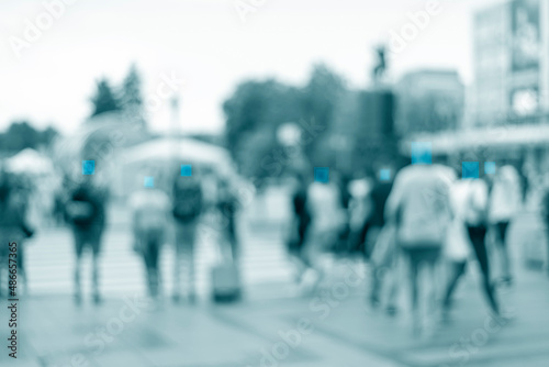 filtered blur abstract people background, unrecognizable silhouettes of people walking on a street