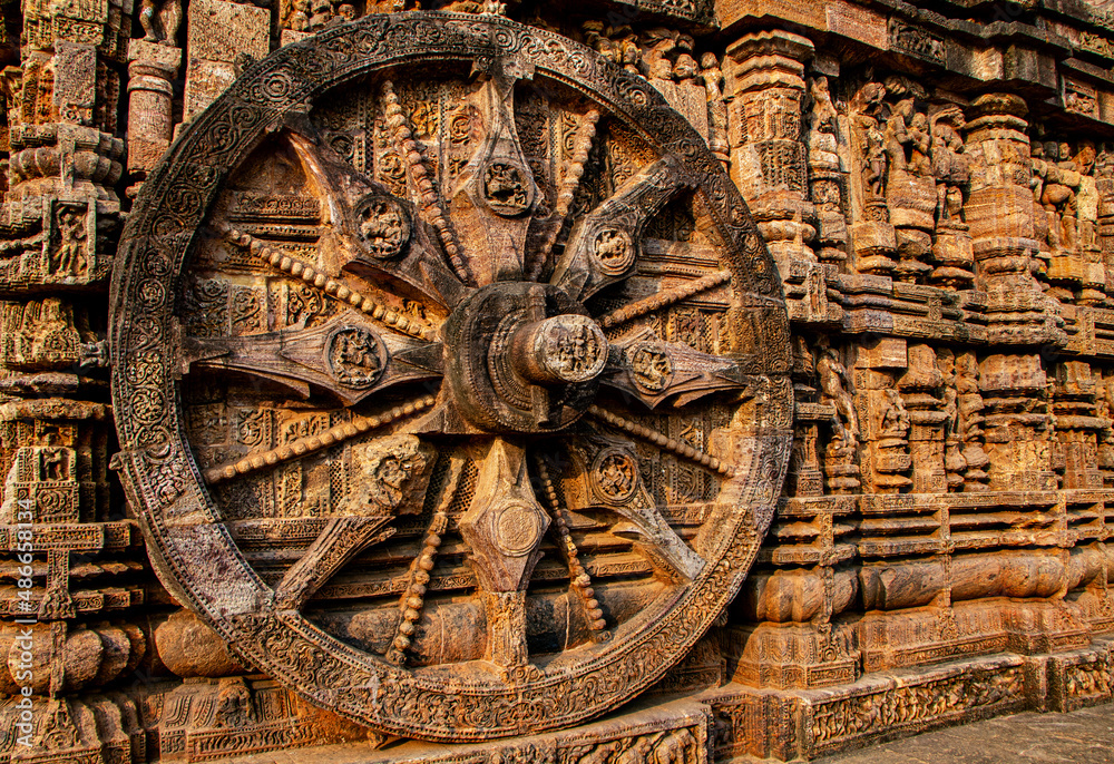 Konark Sun Temple is 13th-century temple at Konark in Odisha, India. Dedicated to the Hindu Sun God Surya, it has appearance of a 100 feet high chariot with immense wheels & horses carved from stone