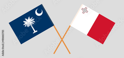 Crossed flags of The State of South Carolina and Malta. Official colors. Correct proportion