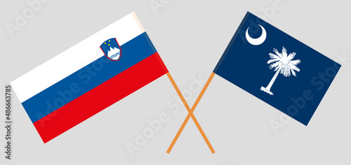 Crossed flags of Slovenia and The State of South Carolina. Official colors. Correct proportion