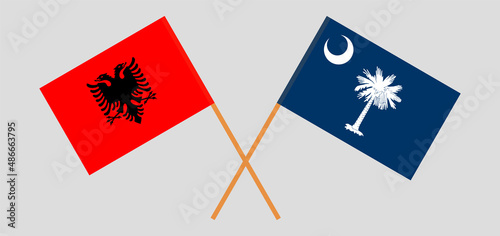 Crossed flags of Albania and The State of South Carolina. Official colors. Correct proportion