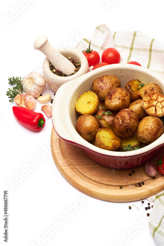 Baked potato in a clay pot isolated on white background