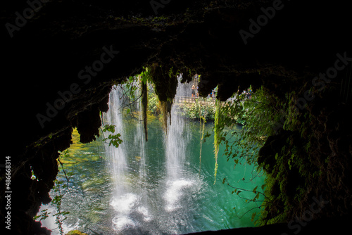 Summer landscape with big waterfall. Duden waterfalls in Antalya. image taken from the cave inside the waterfall.