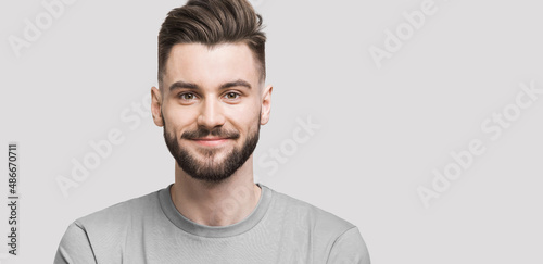 Fotografie Portrait of handsome smiling young man, Smiling joyful cheerful men closeup isol