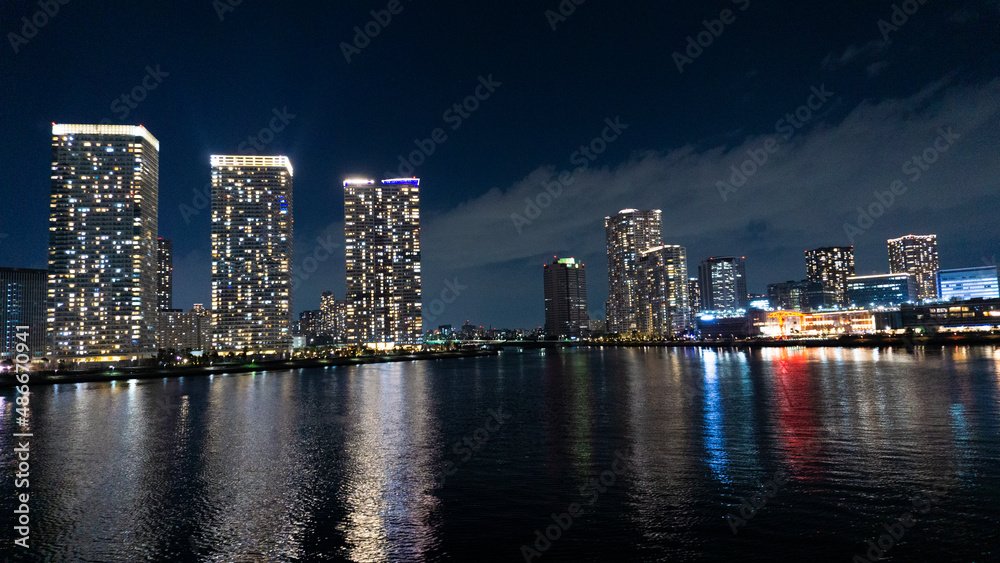 Fototapeta premium Night view of a high-rise condominium along an urban river_12