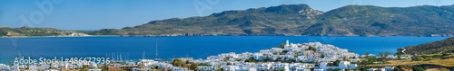 Panorama of Plaka village with traditional Greek church white painted Greek houses and ocean coast. Milos island, Greece © Dmitry Rukhlenko