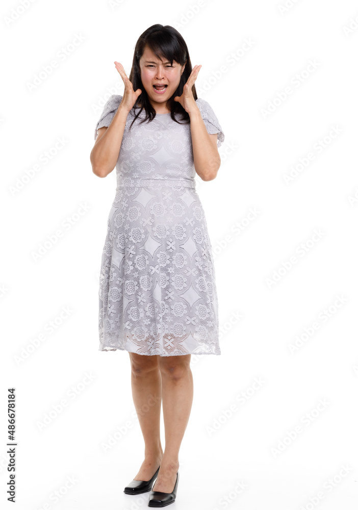 Portrait studio cutout isolated full body shot of Asian young happy trendy female model in beautiful gray lace dress standing posing holding hand on waist smiling look at camera on white background Portrait studio cutout isolated full body shot of Asian young happy trendy female model in beautiful gray lace dress standing posing holding hand on waist smiling look at camera on white background